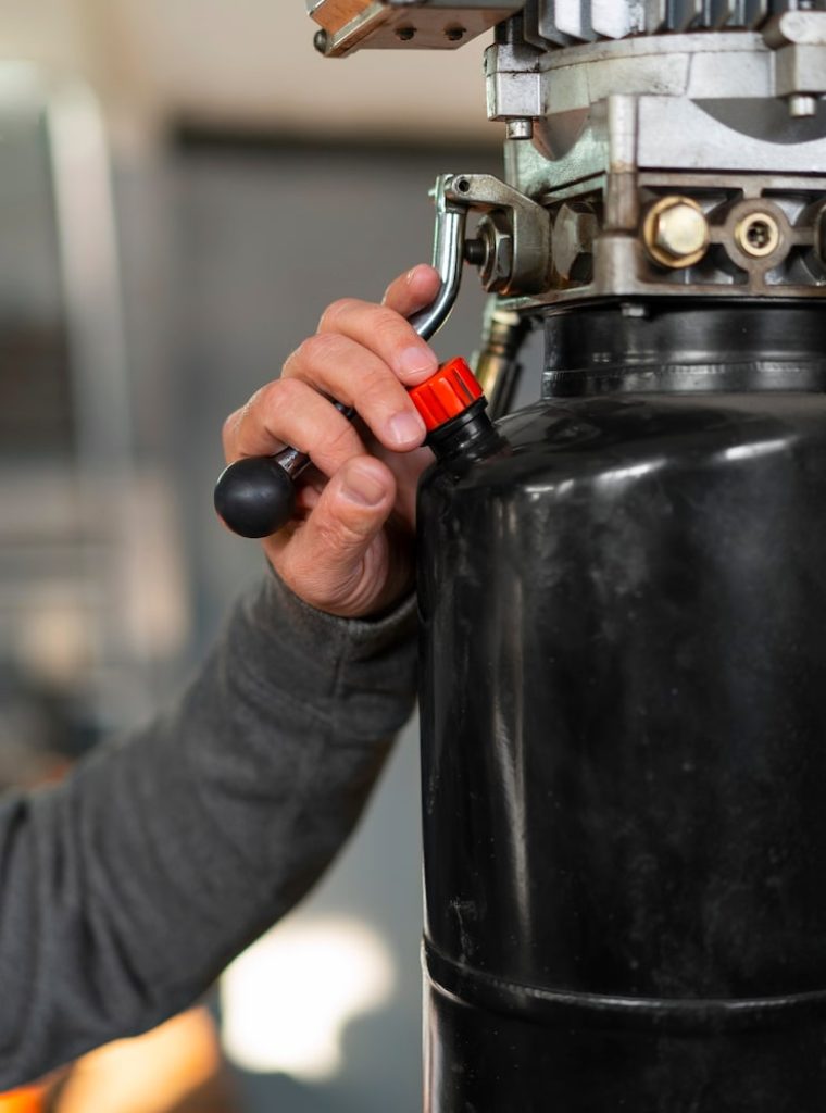 male-car-mechanic-working-car-repair-shop_23-2150367580